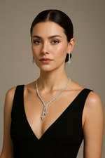 Last inn bildet i gallerivisningen, Woman wearing a black dress and silver necklace against a neutral background