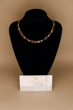 Carica l&#39;immagine nel visualizzatore di Gallery, Necklace on a black mannequin bust with a beige background
