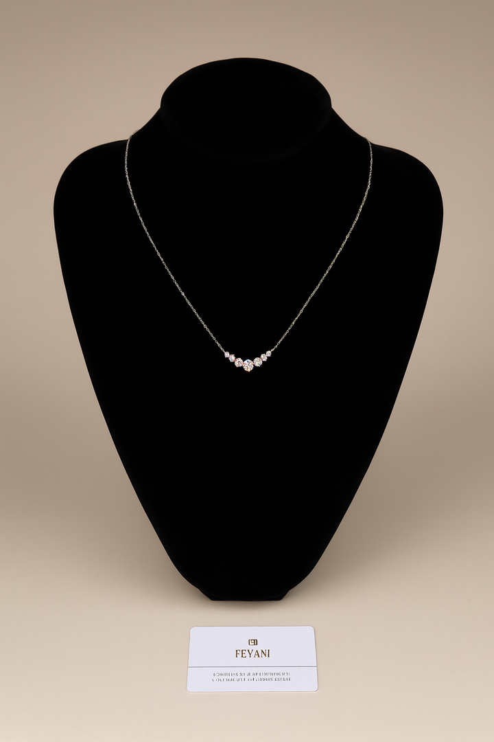 Necklace on a black mannequin with a beige background, featuring the brand 'FEYANI'.
