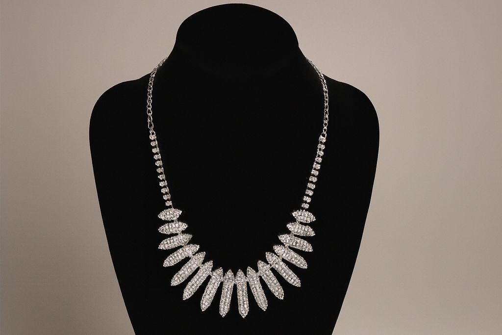 Fevani necklace on a black mannequin bust with packaging and accessories.