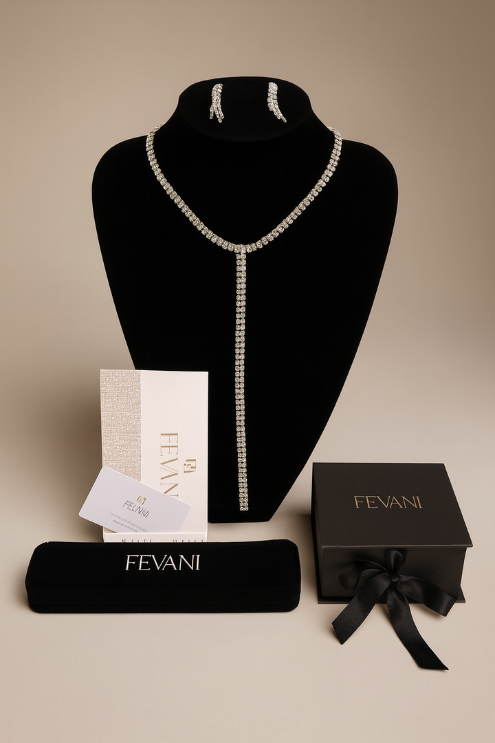 Pearl necklace on a black bust with FEVANI packaging and box on a beige background