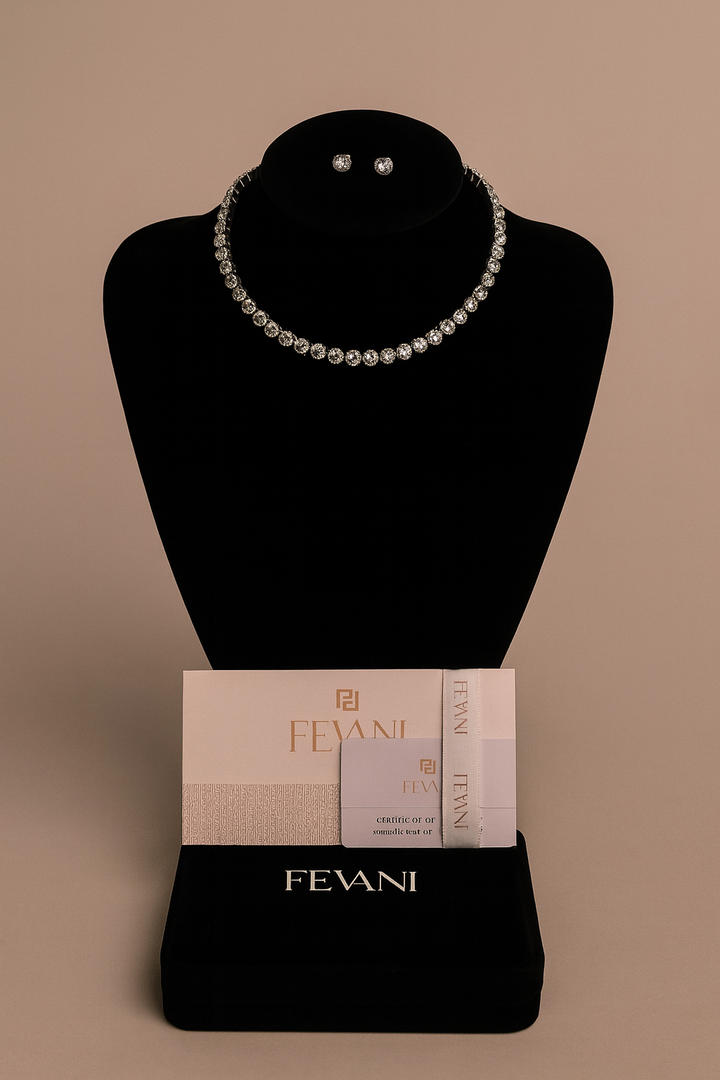 Pearl necklace and earrings on a black mannequin bust with Fevani packaging.